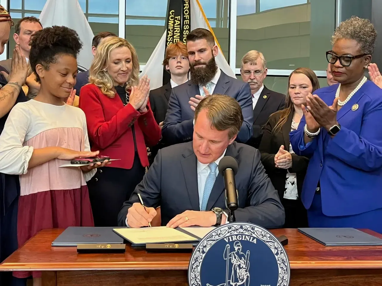 Governor Glenn Youngkin signs SB731 at the Stafford County Public Safety Center